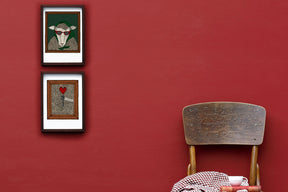 Vivian the Sheep art framed on a red wall